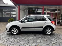 Suzuki SX4 1.6 Comfort | 16" LMV | Trekhaak | ALL-Season | Keyless | Stoelverw. | Dealer onderh. | All-in rijklaarprijs Foto